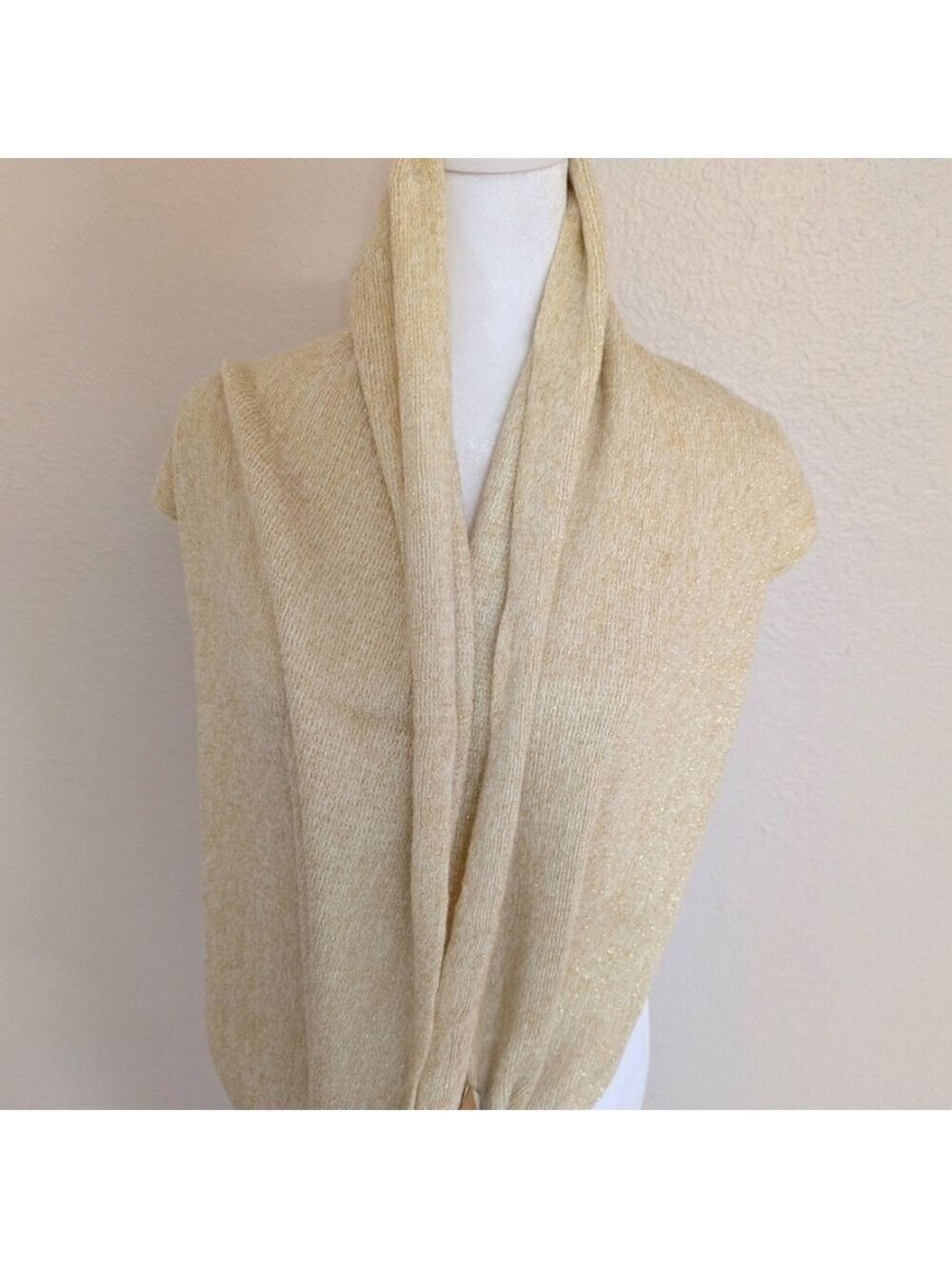 CC New with tags infinity scarf , cream color with gold tread.